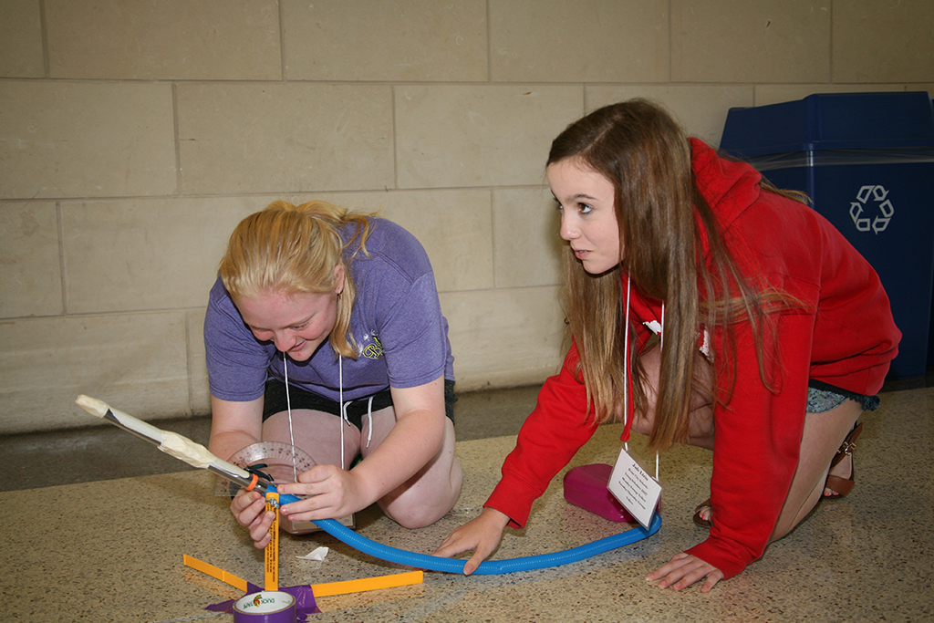 Emily Self (left) and Jade Lizin (right) of Rome Middle School prepare to launch a rocket as part of a project for an Aerospace Engineering class during the Young Scholars Program at GNTC, June 12-15.