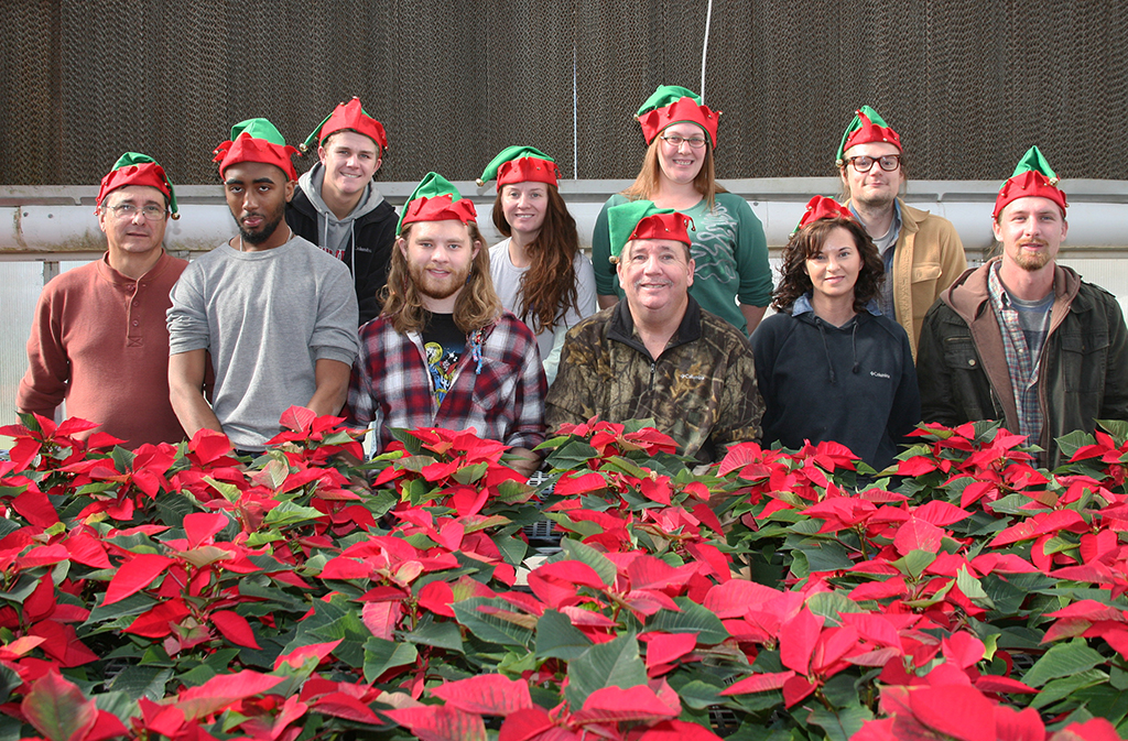 Horticulture students pose in front of the poinsettias that are on sale for $4 each at GNTC’s Floyd County Campus. Front row (from left to right) Nick Barton, Deshaun Rozier, Morgan Lathem, Mark King, Terra Coontz, and John Tarvin. Back Row (from left to right) Lane Strickland, Rachel Barden, Shannon Bryant, and Jeffery King.