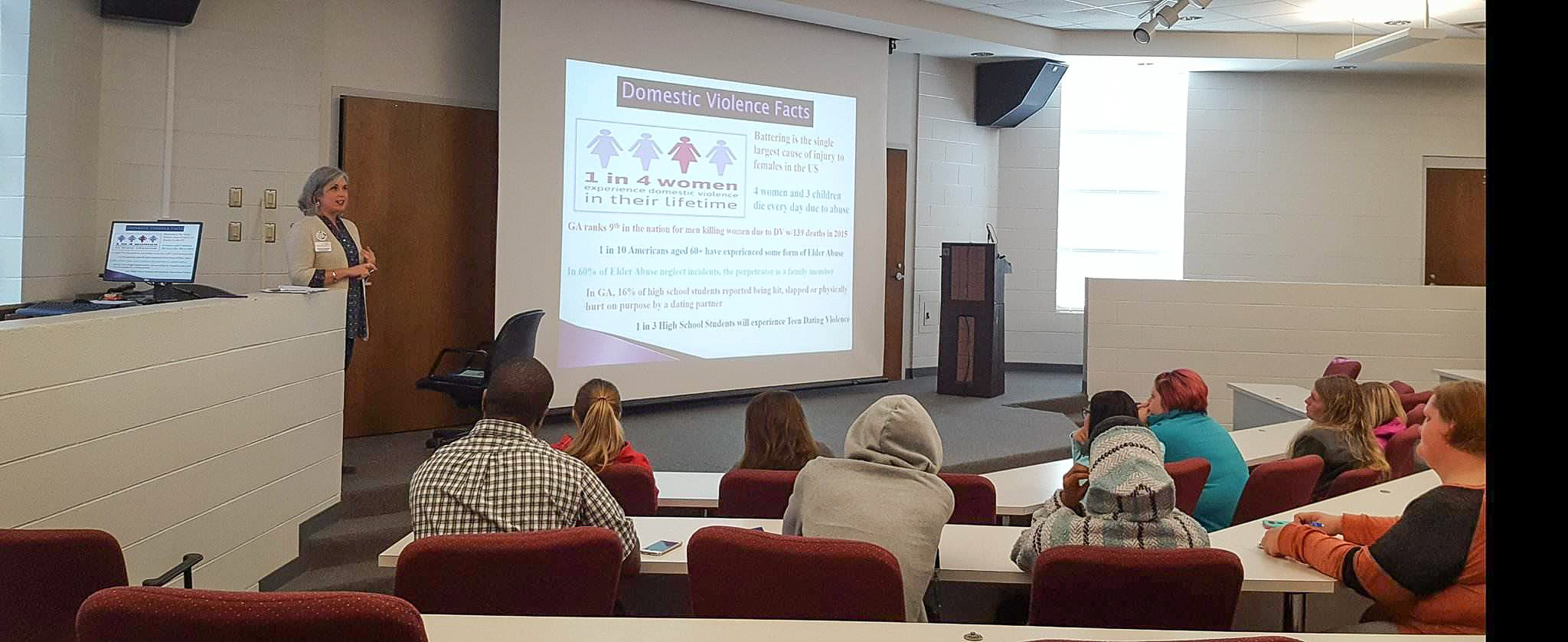 Family Crisis Center (FCC) staffer Becky Daniel speaks with several dozen Georgia Northwestern Technical College students, faculty, and staff Wednesday about what the FCC has to offer. This was part of GNTC’s push to recognize Domestic Violence Awareness month this October.