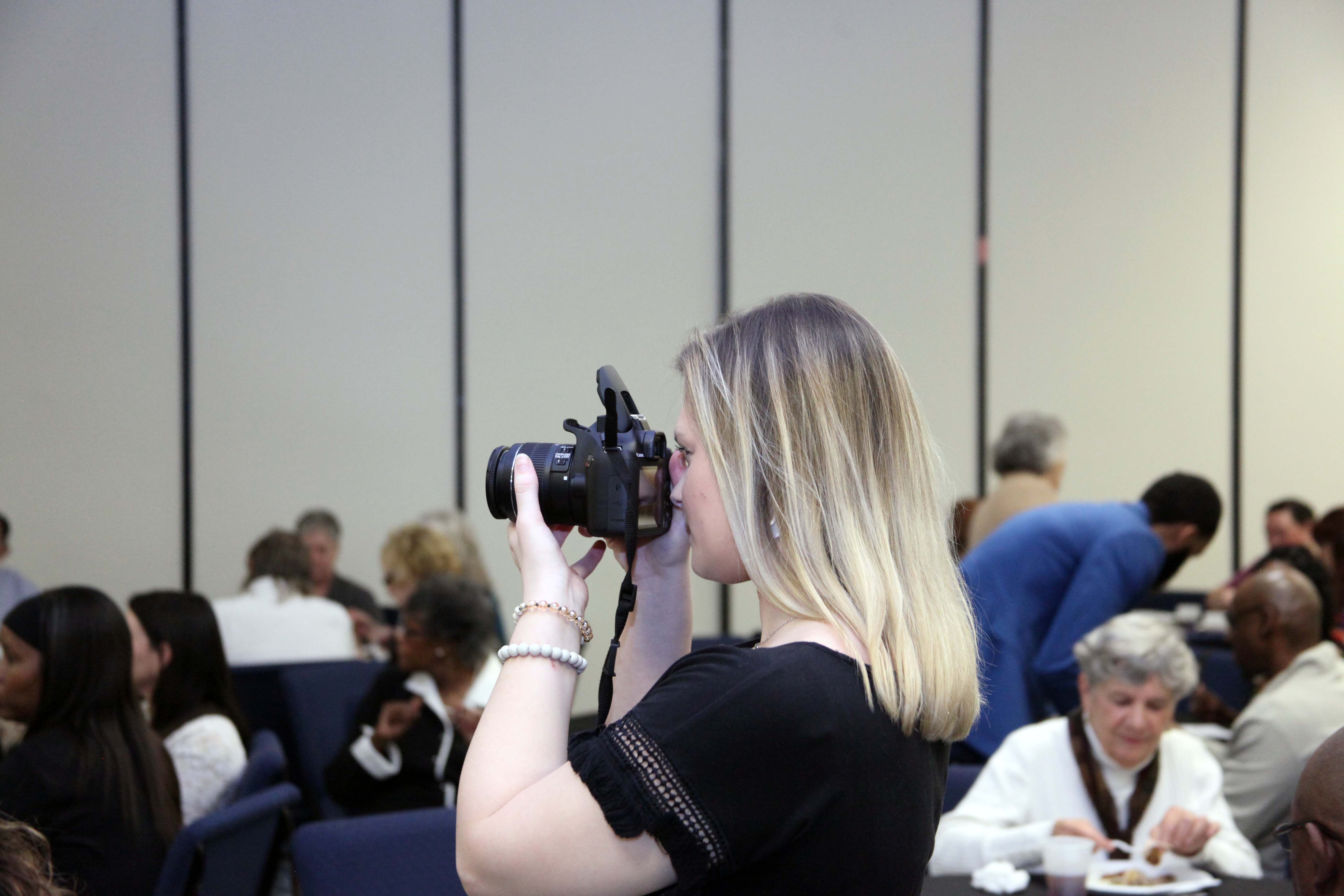 Abby Larry takes photos of the Rome-Floyd County Commission on Children and Youth’s 31st Annual Luncheon. Larry works for the RFCCCY through the Youth Success Academy’s Work Experience program at GNTC.  