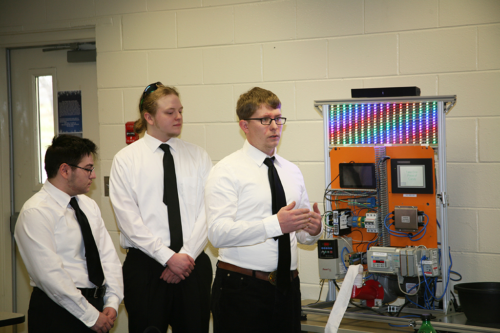Beck Maxwell (left), Jake Woodall (center), and Derek Walck (right) presented a PLC-based candy machine they constructed for the Engineering Technology/Design SkillsUSA Georgia competition. All three students are pursuing degrees in GNTC’s Instrumentation and Controls program. Maxwell was part of a SkillsUSA team last year that won the gold medal in the SkillsUSA statewide competition and the bronze medal in the SkillsUSA national competition. 