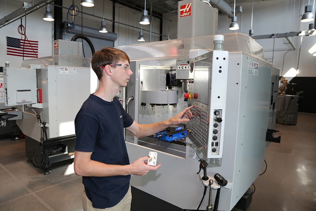 Blade Smith works on one of the HAAS Computer Numerical Control (CNC) machines in the Precision Machining and Manufacturing lab on GNTC’s Whitfield Murray Campus in Dalton. 
