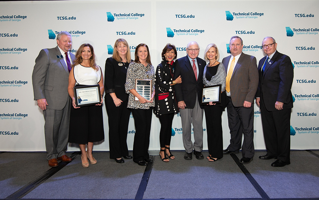 The Board of Directors at GNTC were honored during an awards ceremony at the Technical College System of Georgia 2018 Fall Leadership Conference held in Savannah. (From left to right) TCSG Commissioner Matt Arthur; Michele Taylor, superintendent of Calhoun City Schools and member of GNTC’s Board of Directors; Heidi Popham executive vice president of GNTC; Lisa Odom, executive assistant to the president at GNTC; Barbara Dooley, keynote speaker for awards ceremony; Vince Dooley former UGA football coach and athletic director, and keynote speaker for awards ceremony; Kenna Stock, chief executive officer of Harbin Clinic and member of GNTC’s Board of Directors; Paul Meredith, director of manufacturing at Mohawk and member of GNTC’s Board of Directors; and Pete McDonald, president of GNTC.