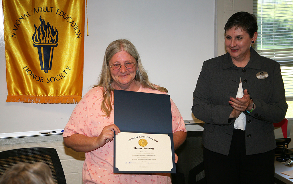 Toni Couey (left) of Rome was inducted into the National Adult Education Honor Society on the Floyd County Campus by Kerri Hosmer (left), vice president of Adult Education at GNTC.