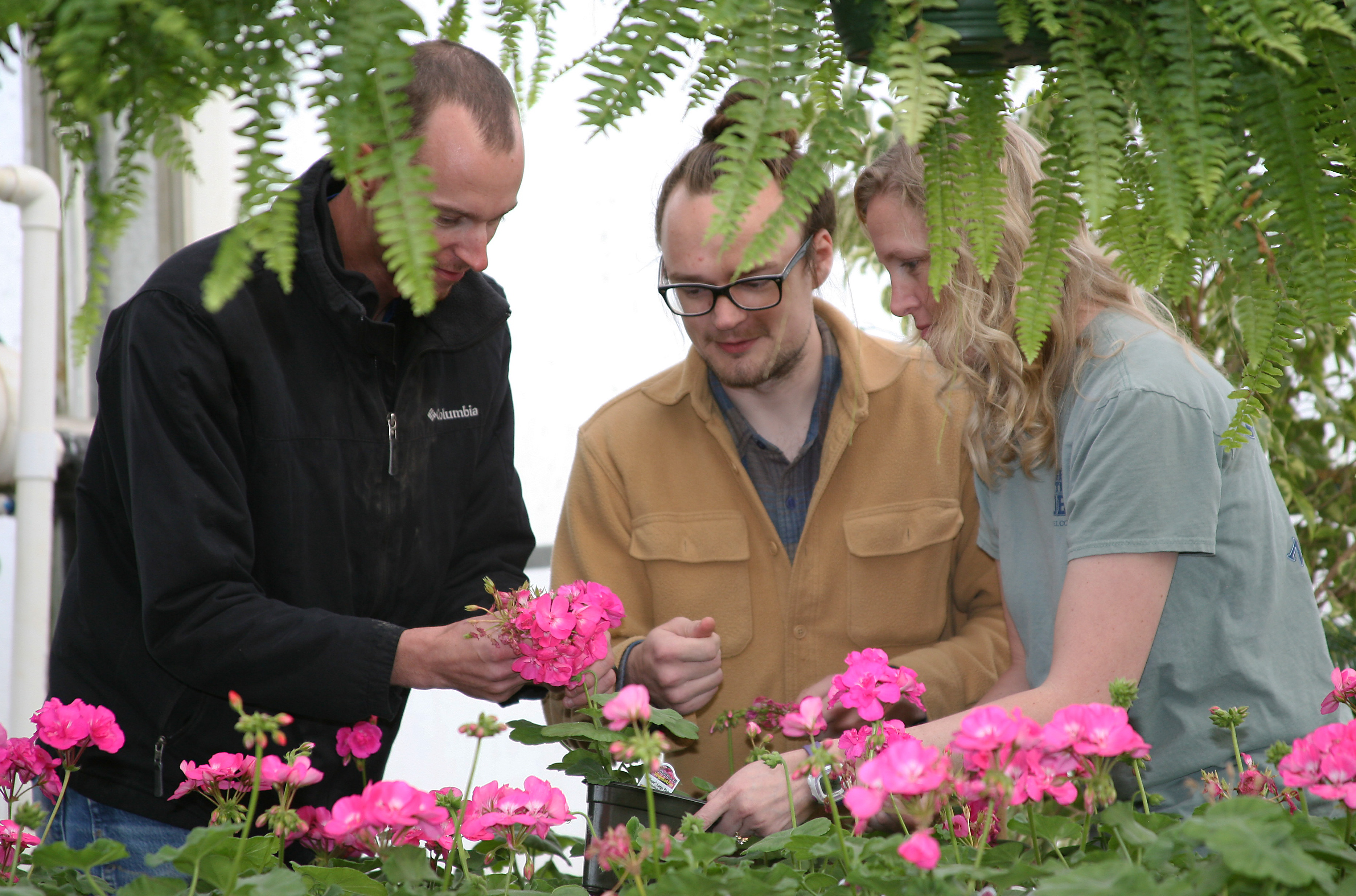 Chase Bohannon (left) of Calhoun, Jeffrey King (center) of Rome, and Jessica Wakefield (right) of Rome prepare for GNTC’s Spring Plant Sale.