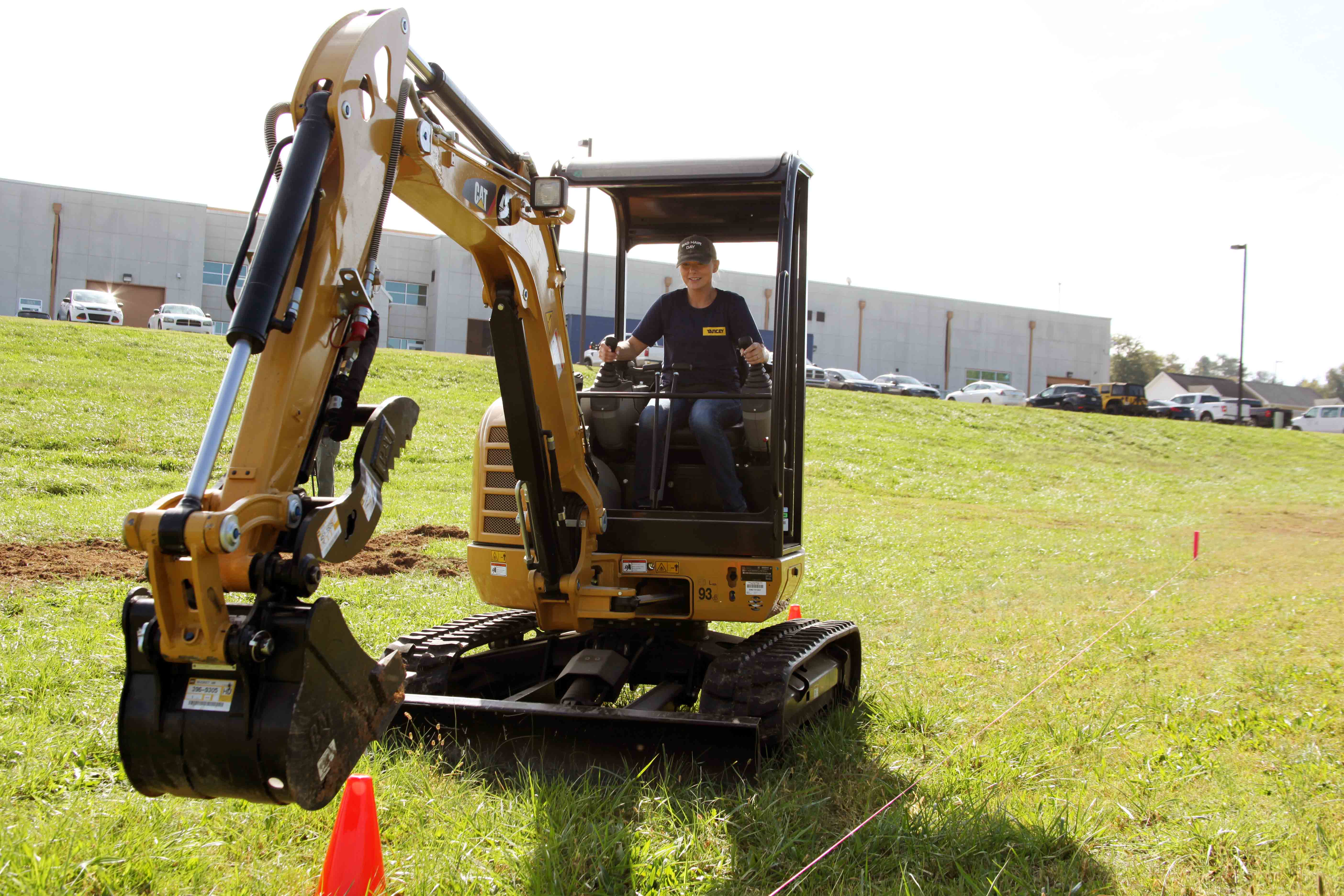 GNTC Construction Management student Jessica Heifner practices on her program’s excavator during an outdoor class session. 