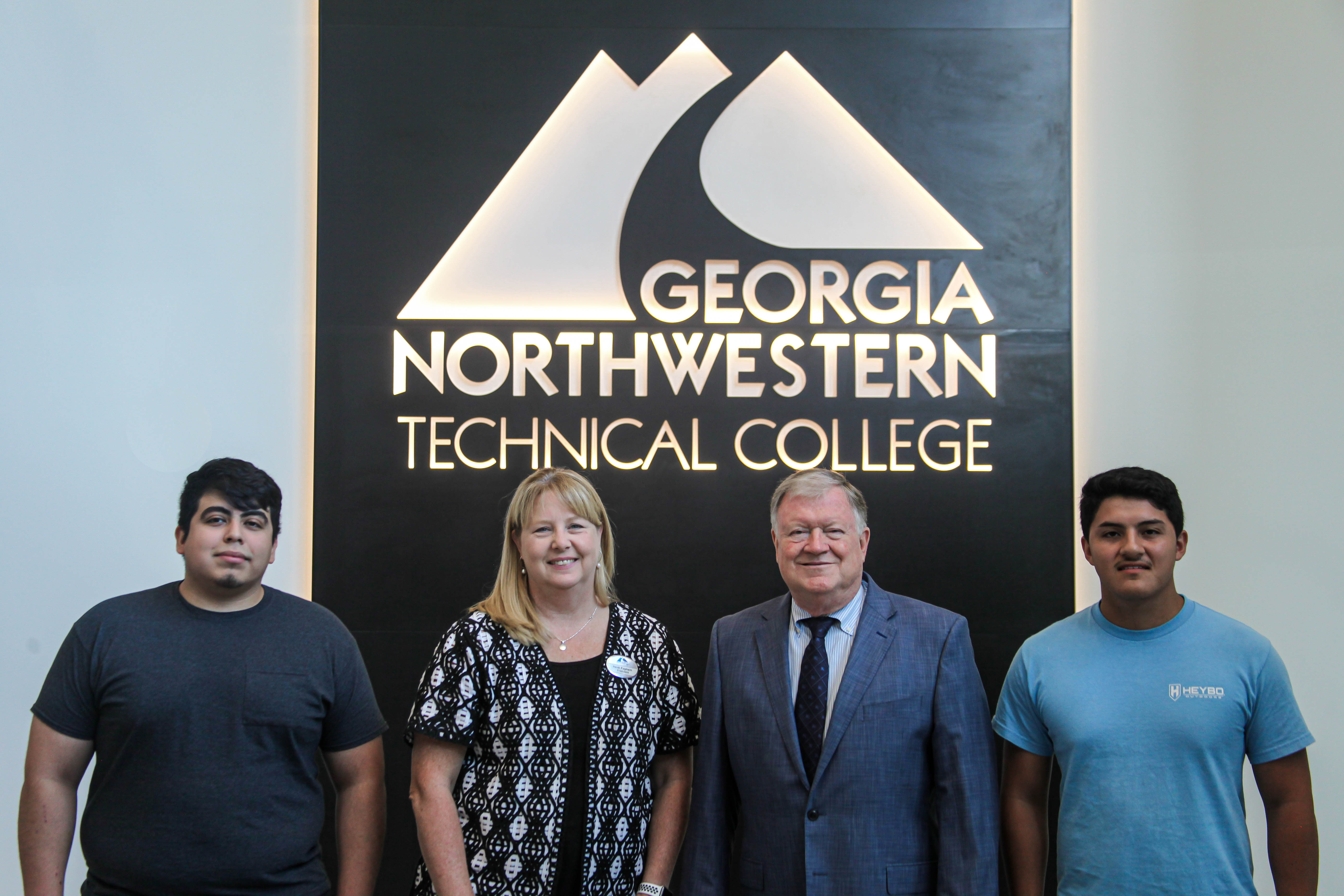(From left to right) Governor Nathan Deal Technical Education Scholarship recipient Jonathan Garcia stands with GNTC President Dr. Heidi Popham, President and CEO of CRI and TCSG Board Member Joe Yarbrough and fellow scholarship recipient Eduardo Hernandez. Not pictured is scholarship recipient Eric Garcia. The three recipients of the award were recognized for their excellence in the Industrial Systems Technology program on GNTC’s Whitfield Murray Campus in Dalton. 
