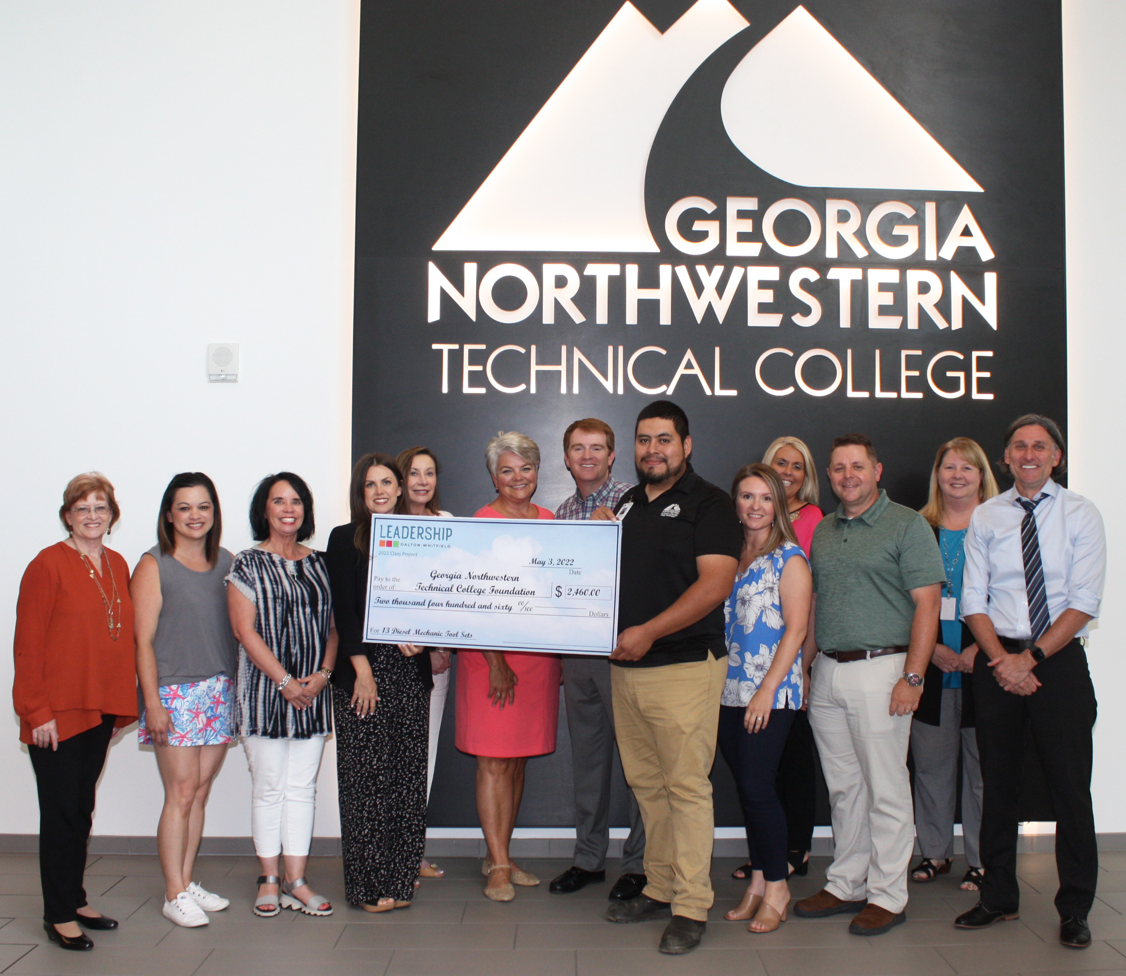  (From left) Phyllis Stephens, Greater Dalton Chamber of Commerce; Kapua Keefe, Dalton Public Schools; Tracie Simmons, Whitfield County Schools; Rachel Ogle, Hamilton Medical Center; Alisa Basaraba, North Georgia Electric Membership Corp.; Terri Woodruff, Anna Shaw Children’s Institute; Andrew Barkley, Shaw Industries; Salvador Arreguin, director and instructor of the Diesel Equipment Technology program at GNTC; Abbi Smith, Fabric Sources International; Dr. Elizabeth Anderson, vice president of Academic Affairs at GNTC; Chris Parker, Whitfield County Schools; Dr. Heidi Popham, president of GTNC; and Josh Weeks, Conasauga Judicial Circuit pose for the presentation of a $2,460 check to GNTC to purchase basic tool kits for 12 Diesel Equipment Technology students.