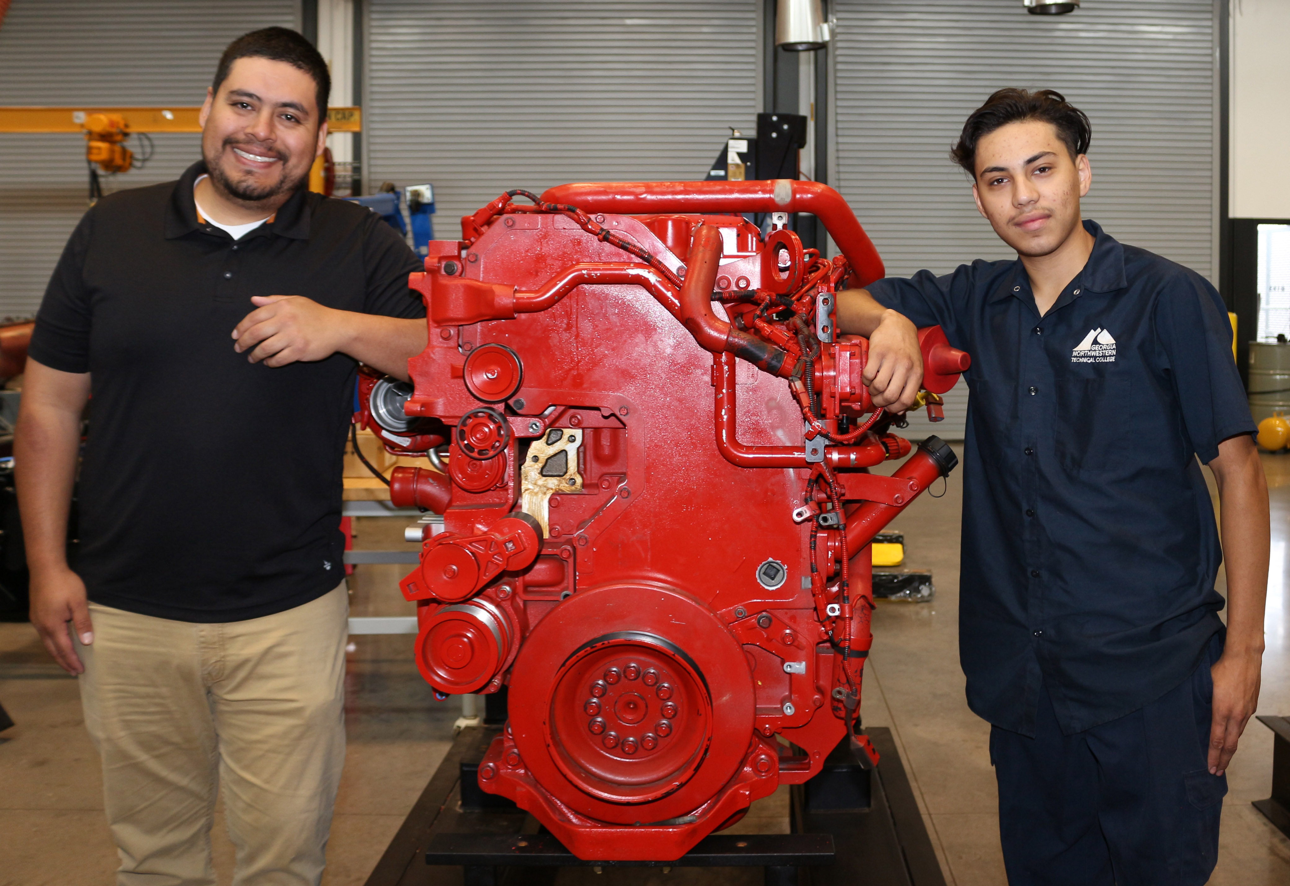 Salvador Gonzalez, program director and instructor of Diesel Equipment Technology at Georgia Northwestern Technical College (GNTC), (right) congratulates Cristian Tirador Cervantes, GNTC student and recipient of the Diesel Equipment Technology Scholarship. Tirador Cervantes said he will use the funds to pay for tuition as he pursues his Diesel Equipment Technology diploma; he expects to graduate in December 2023. Gonzales was named GNTC’s 2023 Rick Perkins Instructor of the Year and was recently selected as First Runner-Up for the Technical College System of Georgia (TCSG) 2023 Rick Perkins Instructor of the Year.