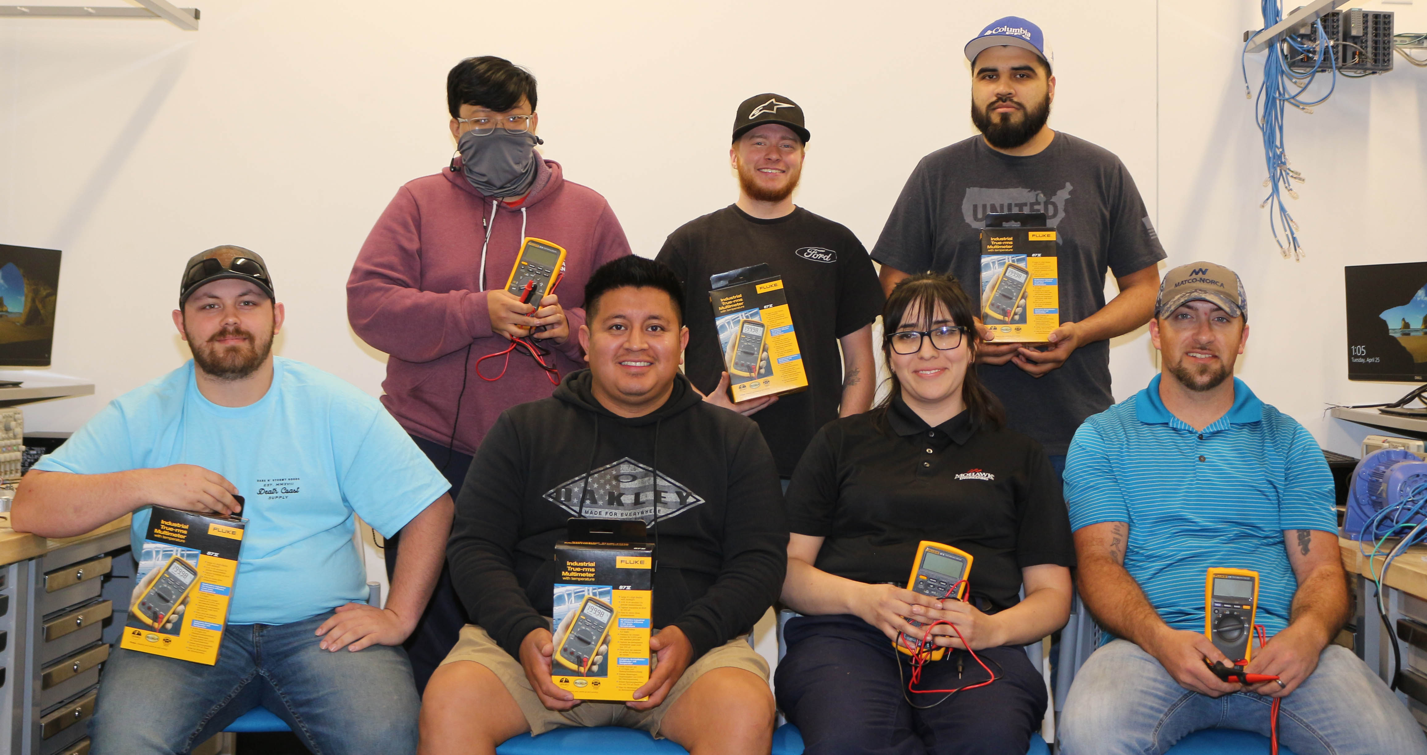 (From left, seated) GNTC Automation Engineering Technology students Eric Gossett, Victor Pascual, Alma Mitchell, Chris Silvers; (standing) Tun Len, Kayden Parker and Eduardo Guerrero pose with the multimeters they received through the Fluke Education Partnership Program.