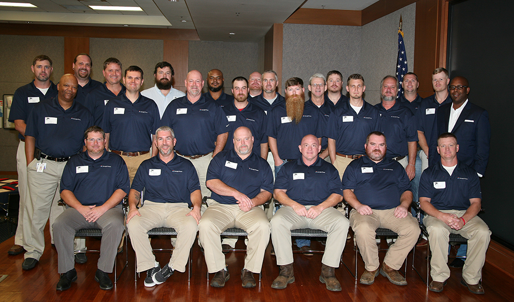 (Back row, from left to right) Aaron Bryan, Eric Hester, Eric Boatner, Nick Wade, Kenneth Whitehead, Jeff Pace, Steve Bailey, Tony Maxwell, Tyler Price, Ben Stroupe, and Elisha Starley.

(Middle row, from left to right) Jerry Rowland Jr., Jathan Turner, Greg Banks, Zach Heaton, Josh Moates, Josh Freeman, Michael Newton, and Johnny Howze, Scherer Plant Manager.

(Front row sitting, from left to right) Justin Clemons, Rodney Betsill, Barry Franklin, John Rowland, Chris McAlister, and David Wright. 

(Not pictured) Kevin Kittle.
