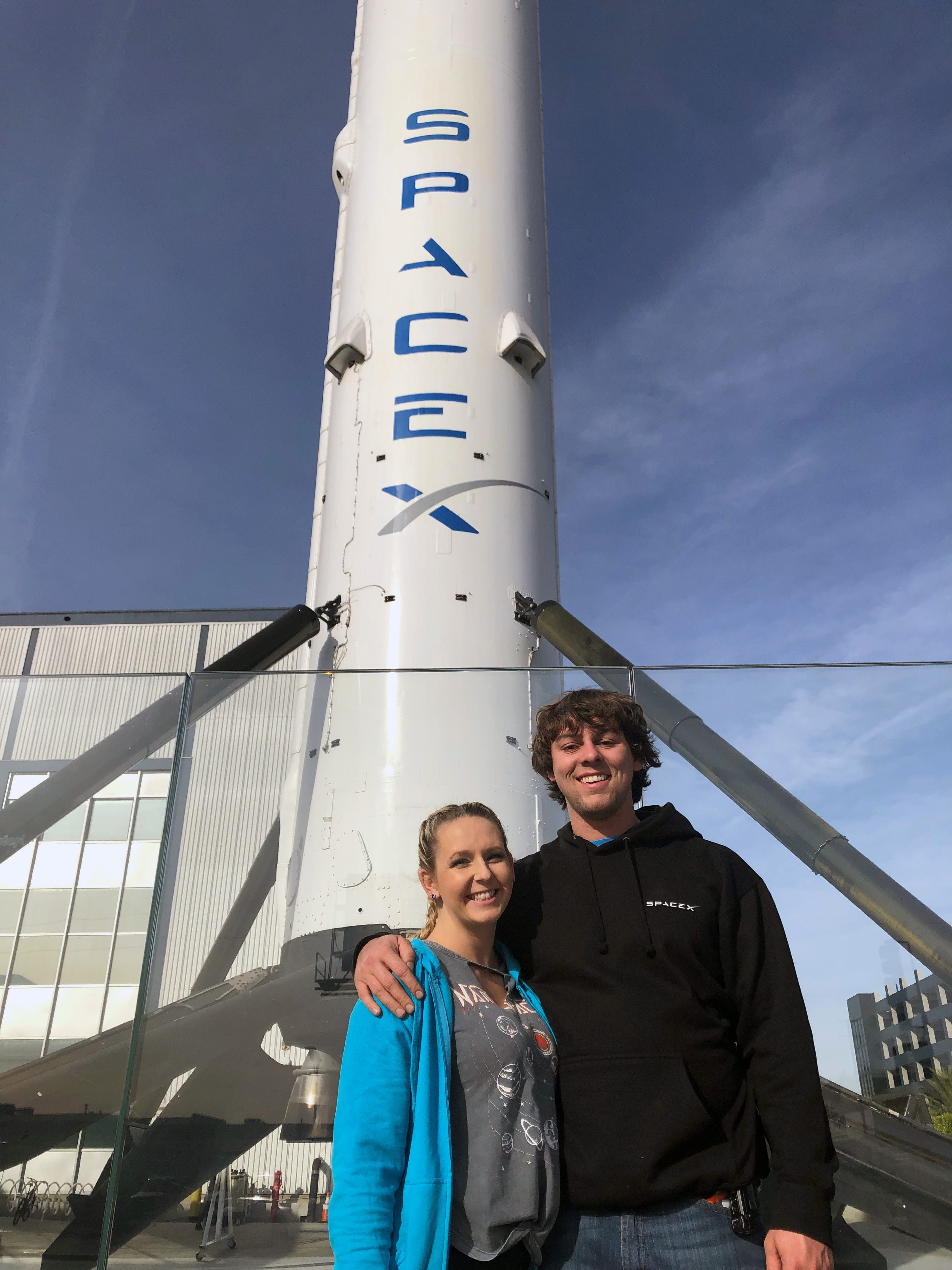 GNTC alumnus Dusty Powell (right) stands with his girlfriend D’ana Gay in front of the SpaceX headquarters in Hawthorne, California where he works as a maintenance technician.