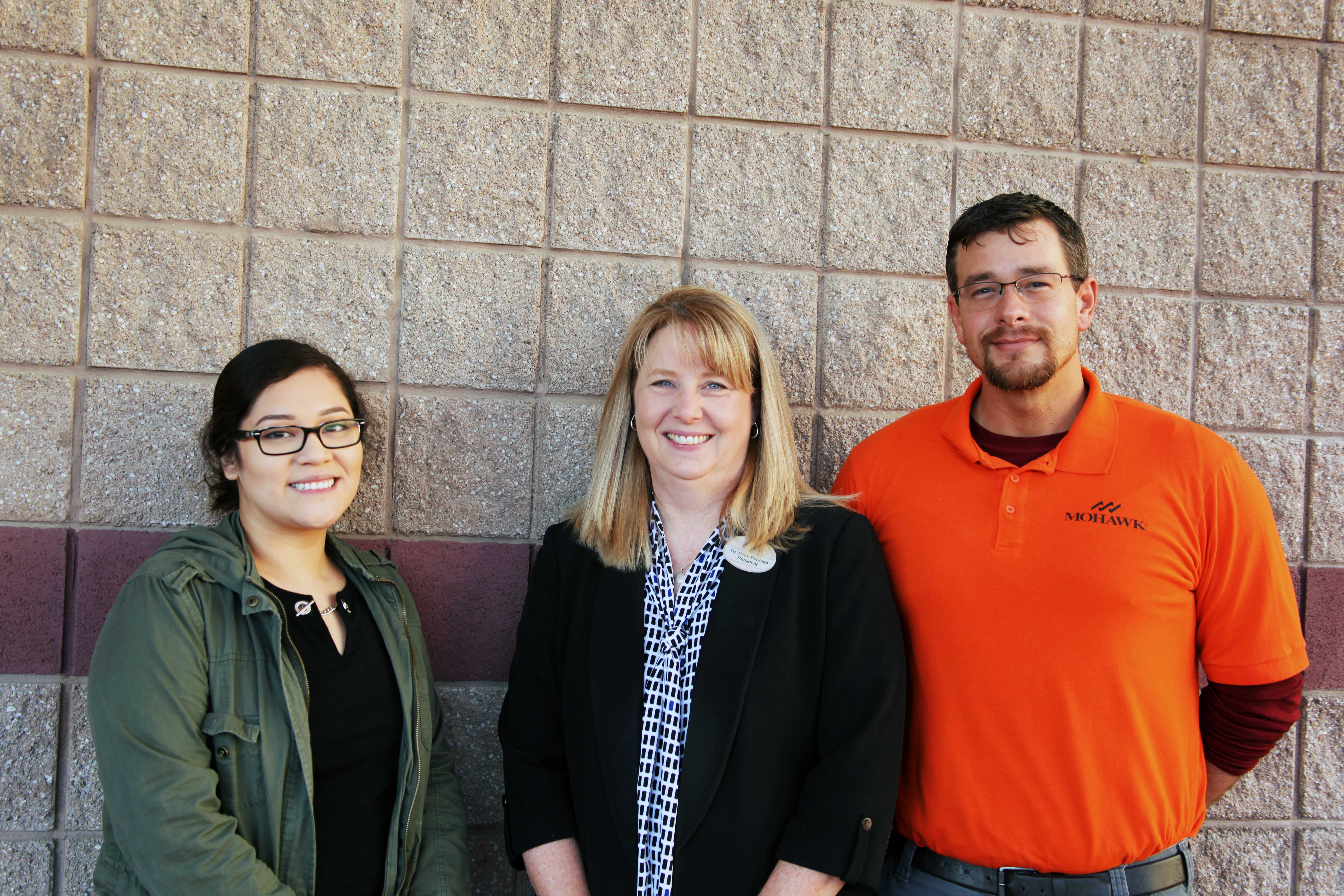 Flor Querido (left), Business Management student and president of the Phi Beta Lambda student organization at GNTC, stands with Dr. Heidi Popham (center), president of GNTC; and Carl Watts (right), graduate of the Electronics Technology and Industrial Systems Technology programs at GNTC before the “Good Morning Dalton” event held at the Dalton Convention Center.