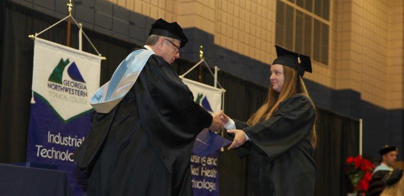 Walker County, Georgia native Haleigh Condra receives her award in Early Childhood Care and Education from Georgia Northwestern Technical College President Pete McDonald.