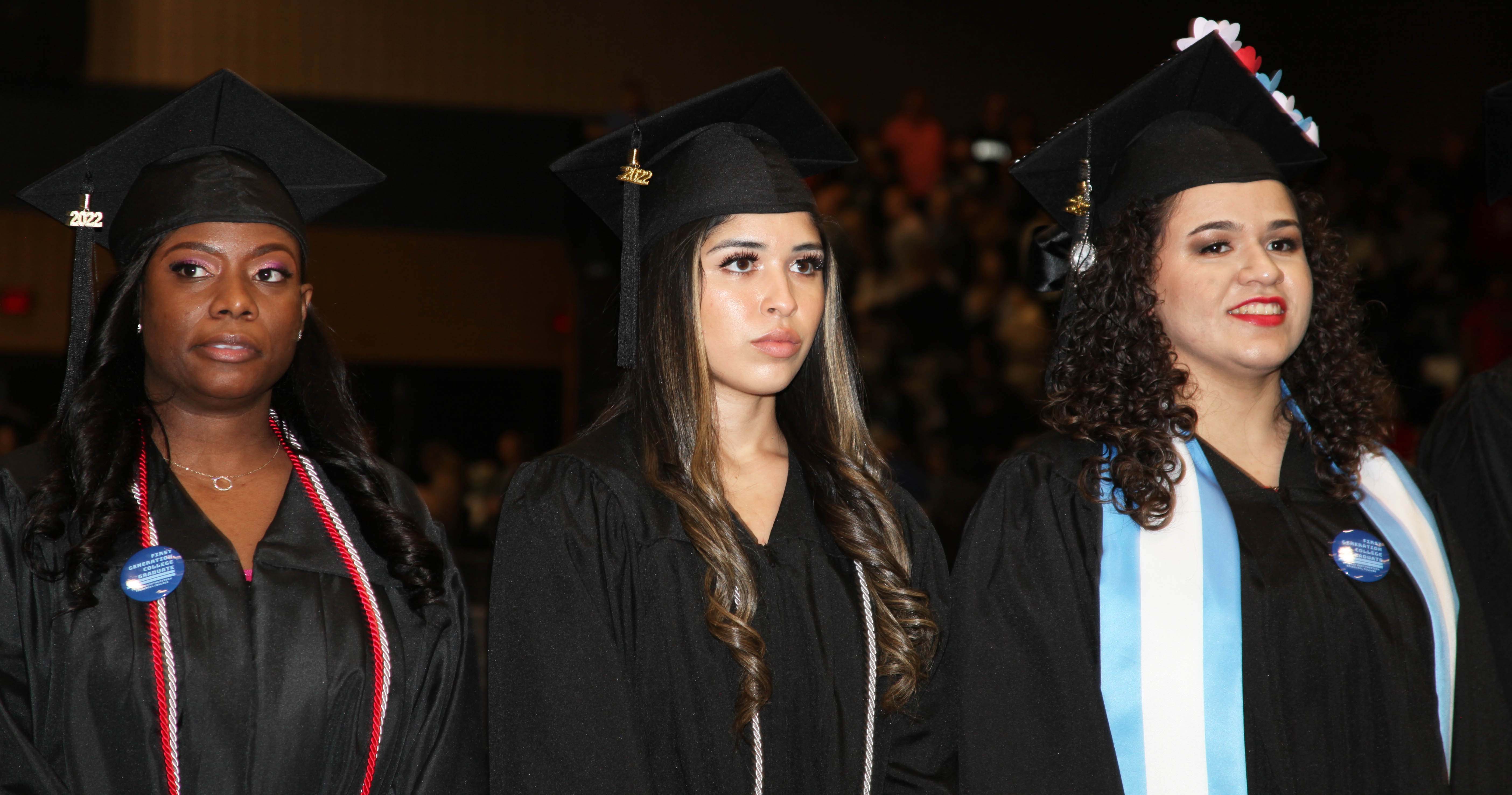 (From left) Latice M. Allen, Daisy Amber Azua and Arlyn Yamileth Barcarcel prepare to take their seats for the ceremony.