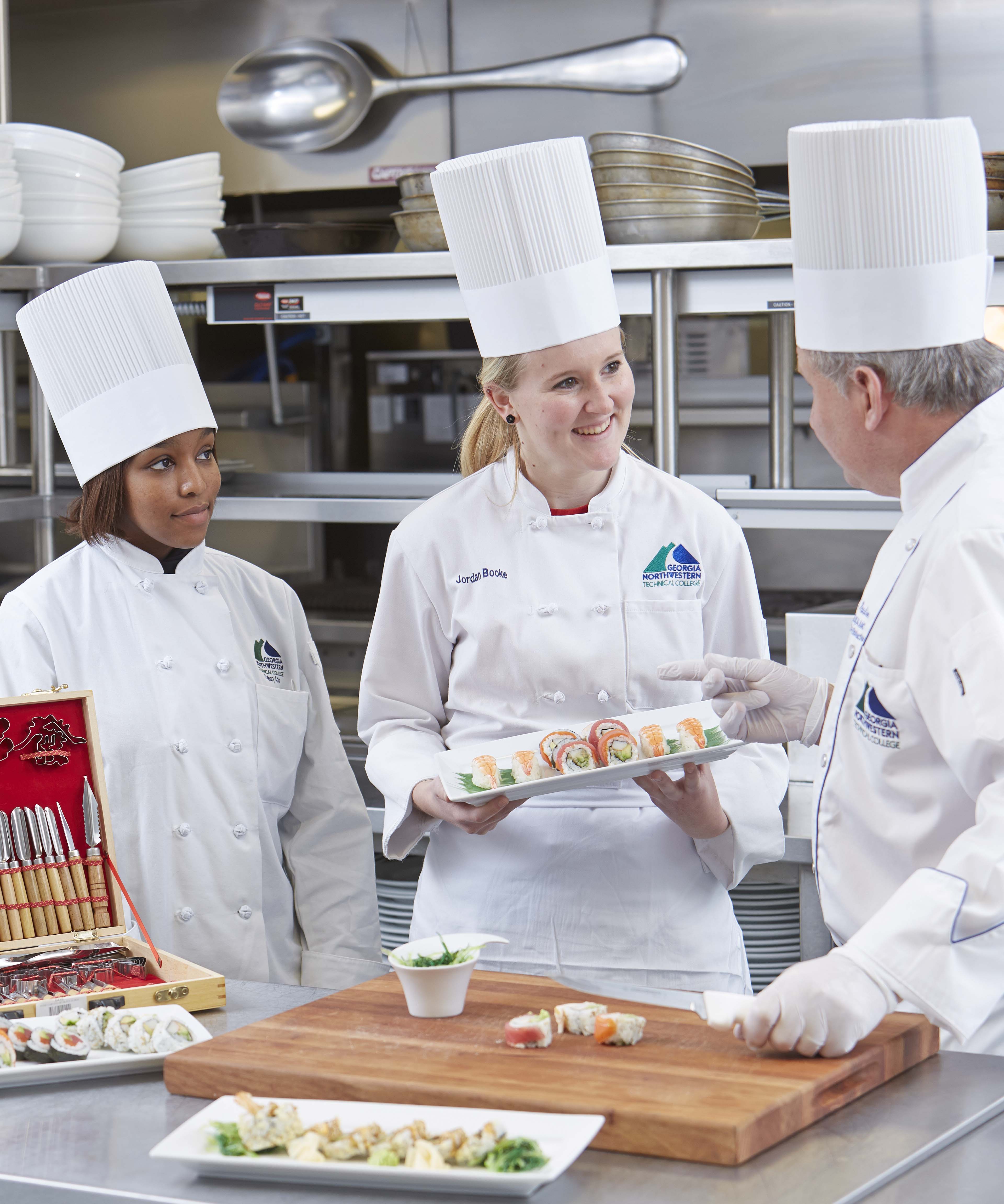 Chef Greg Paulson (right) teaches Culinary Arts students to prepare Japanese cuisine.