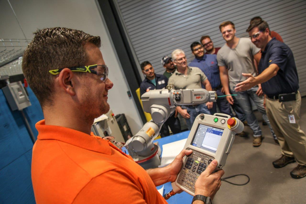 Students in a class within the brand new Automation Engineering Technology program on the Whitfield Murray Campus of Georgia Northwestern Technical College watch closely as a robotics demonstration takes place.