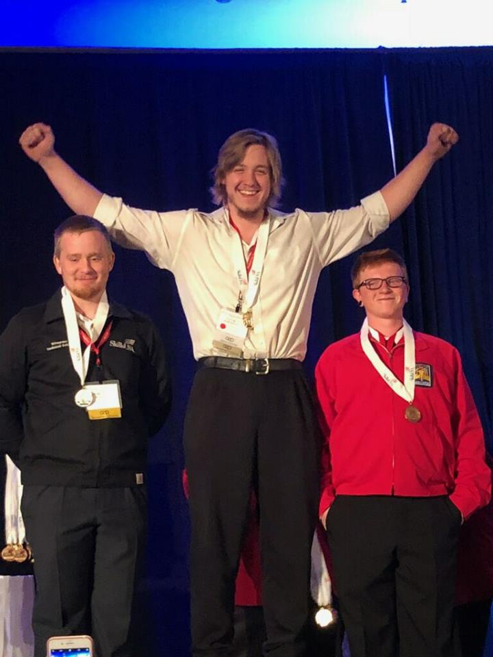 GNTC Welding student Jacob Hargrove, center, stretches out his arms in victory after being named the gold medal winner in the SkillsUSA Georgia Welding competition this past spring. The Catoosa County, Georgia resident is one of 17 GNTC students who have qualified to compete against the best in the country at their professions at the National SkillsUSA Competition in Louisville, Kentucky this week.