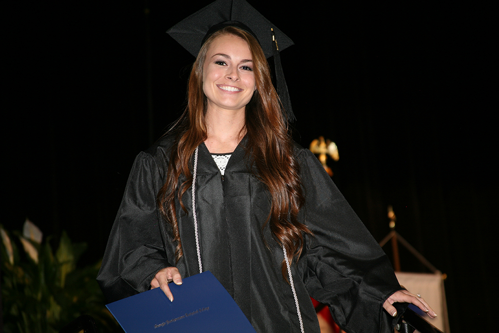 Jessica Holcomb celebrates after getting her associate degree in Nursing.