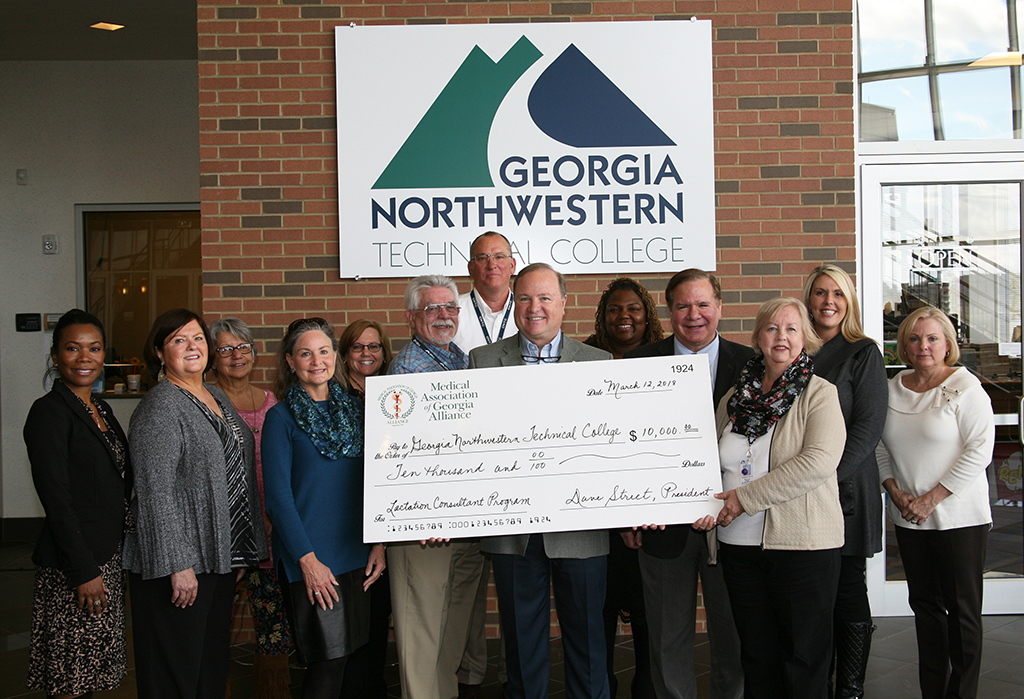 (From the left to right) Takiyah Kaser, MAG Alliance member; Kat Chiu, president of the Georgia Breastfeeding Coalition; Bea Stitzer, assistant dean of Public Service Technologies at GNTC; Merrilee Gober, past president of the MAG Alliance; Jody Vangrov, dean of Math and Sciences at GNTC; Frank Pharr, dean of Health Technologies at GNTC; Tom Bojo, dean of Public Service Technology at GNTC; Dave Street, president of the MAG Alliance; Sasha Kahiga, curriculum program specialist at the Technical College System of Georgia; Dr. John Antalis, physician representative for the MAG Alliance and Georgia Composite Medical Board member; Kathy Kerce, director of the Lactation Consultant program at GNTC; Elizabeth Anderson, vice president of Academic Affairs at GNTC; and Michelle Beatson, Administrative liaison to Institutional Advancement at GNTC, pose for a picture during a ceremony on the Gordon County Campus for the new Lactation Consultant program.