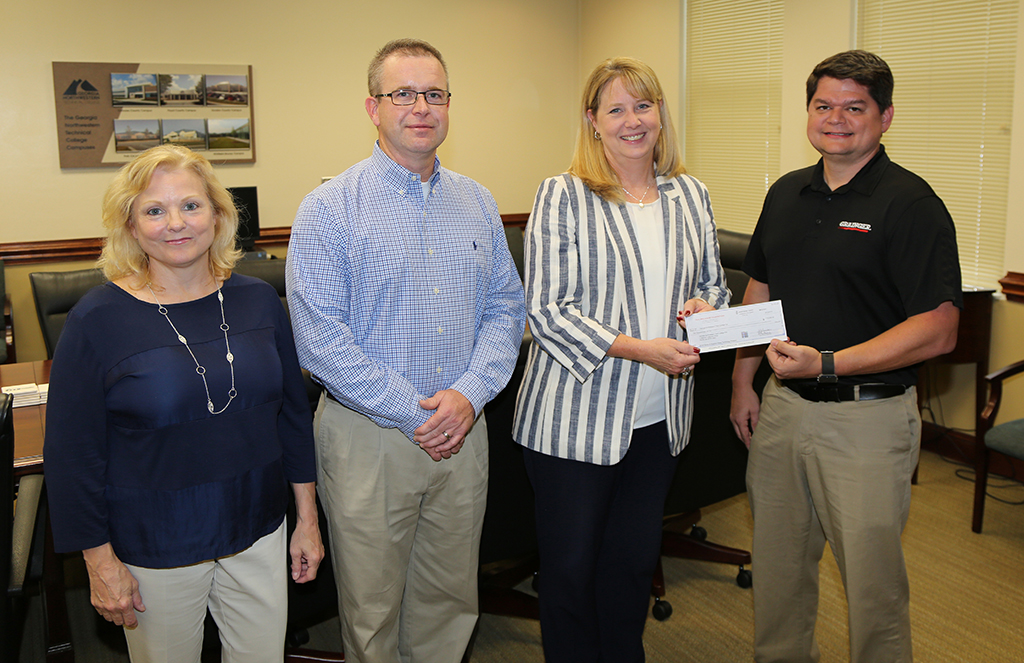 Michelle Beatson (from left), Foundation Administrator at GNTC, stands with Jay Still, Manager, Onsite Services Manager at Grainger and GNTC Foundation Trustee, GNTC President Heidi Popham and Gregory Faro, Branch Network Manager at Grainger after he presented the Diesel Equipment Technology program with a $10,000 donation. 