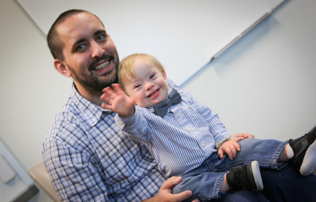 GNTC Logistics and Supply Chain Management student Jason Warren poses with his son, Lucas Warren in a Logistics and Supply Chain Management classroom on the Catoosa County Campus. Lucas is the 2018 Gerber Spokesbaby as selected by the Gerber Products Company. More than 140,000 photos were submitted by families nominating their children for a chance to be named the Gerber Spokesbaby of the Year.