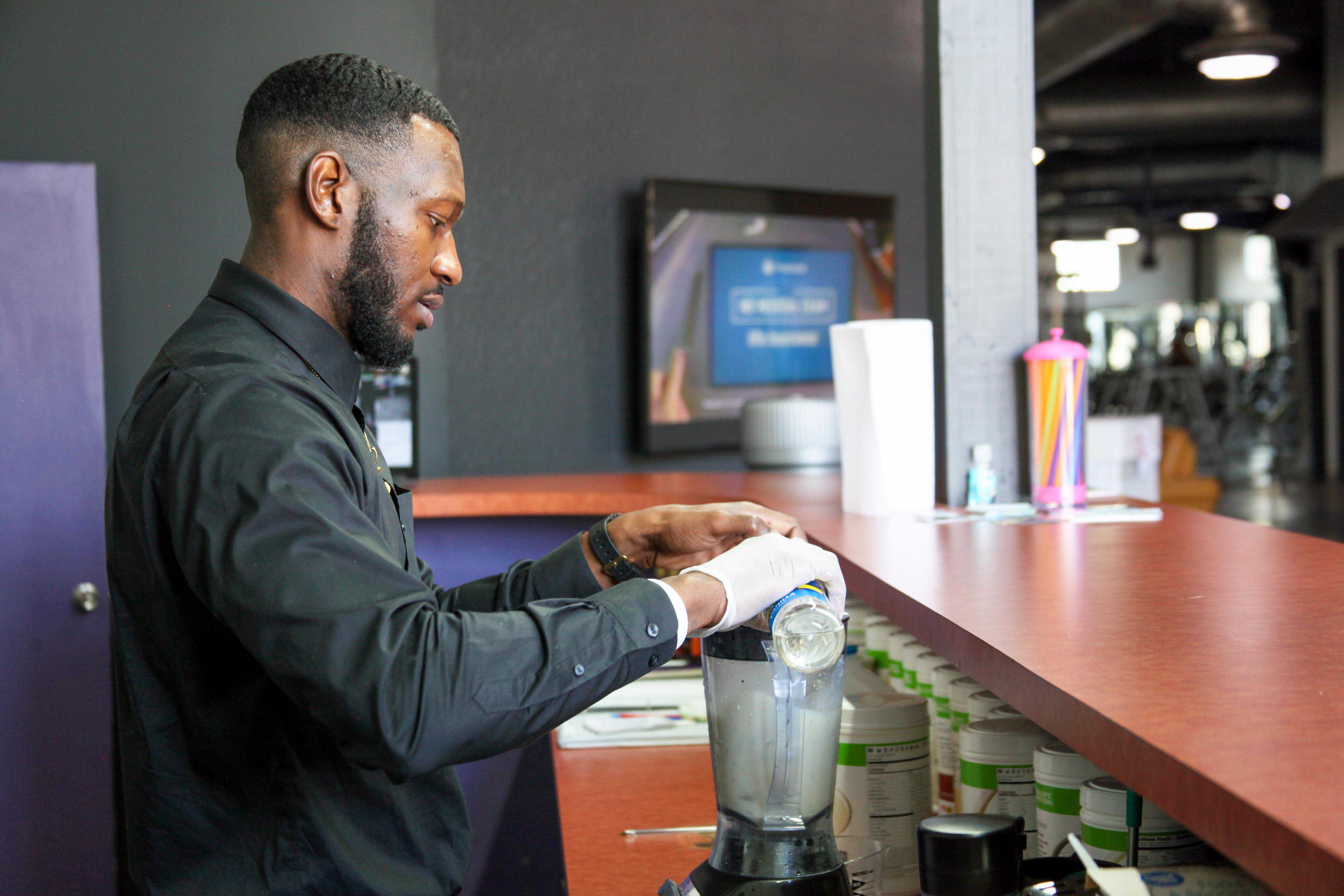 Jalen Hamilton, GNTC graduate and owner of A1 Nutrition makes a cookies and cream meal replacement shake. Hamilton operates out of Firehouse Gym Calhoun serving both members of the gym and the public. 