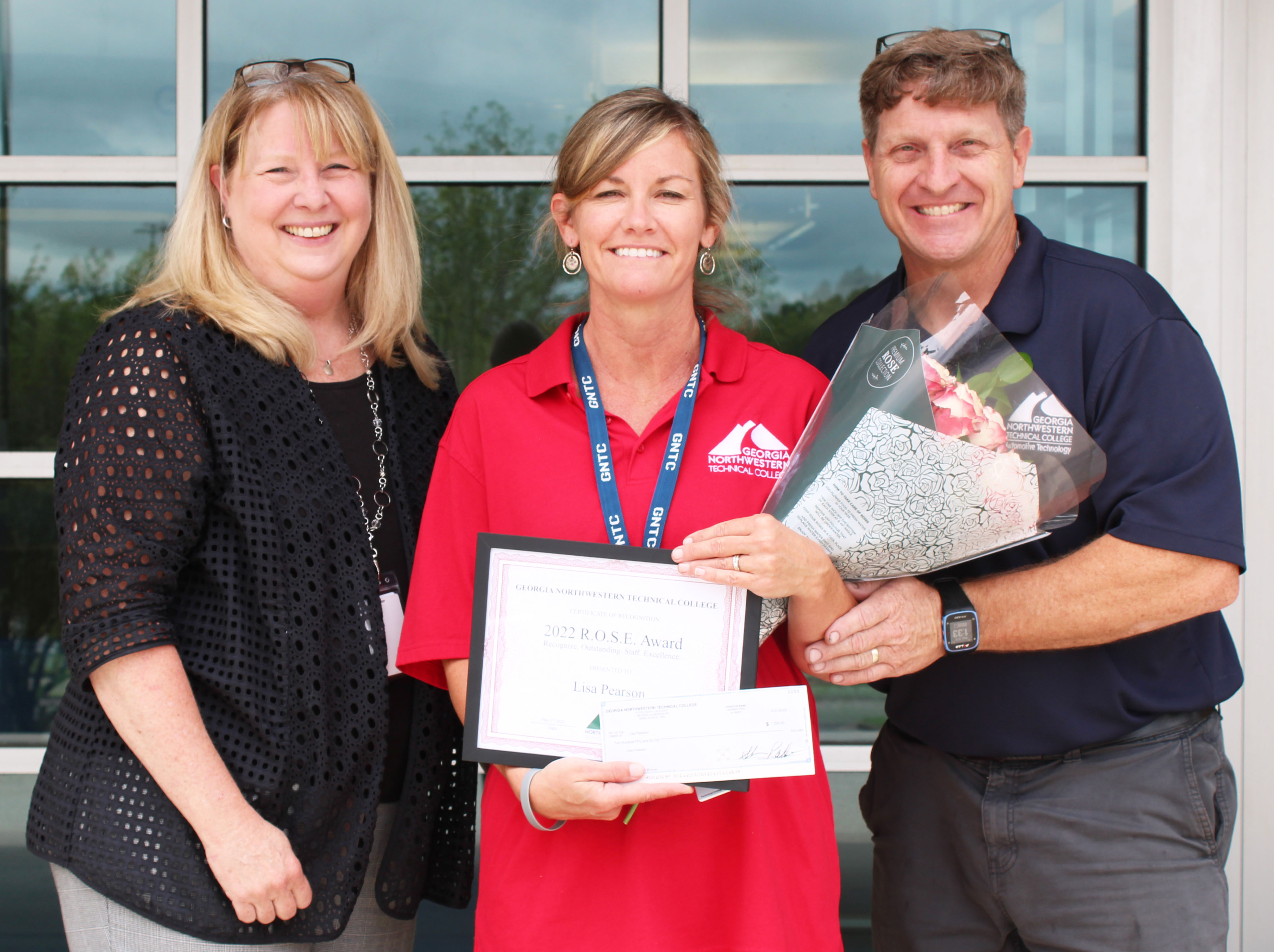 (From left) Dr. Heidi Popham, GNTC president; Lisa Pearson, Student Success coach at GNTC’s Walker County Campus; and Troy Peco, assistant dean of Industrial Technologies and program director and instructor of Automotive Technology, celebrate Pearson’s selection as GNTC’s 2022 ROSE Award winner.