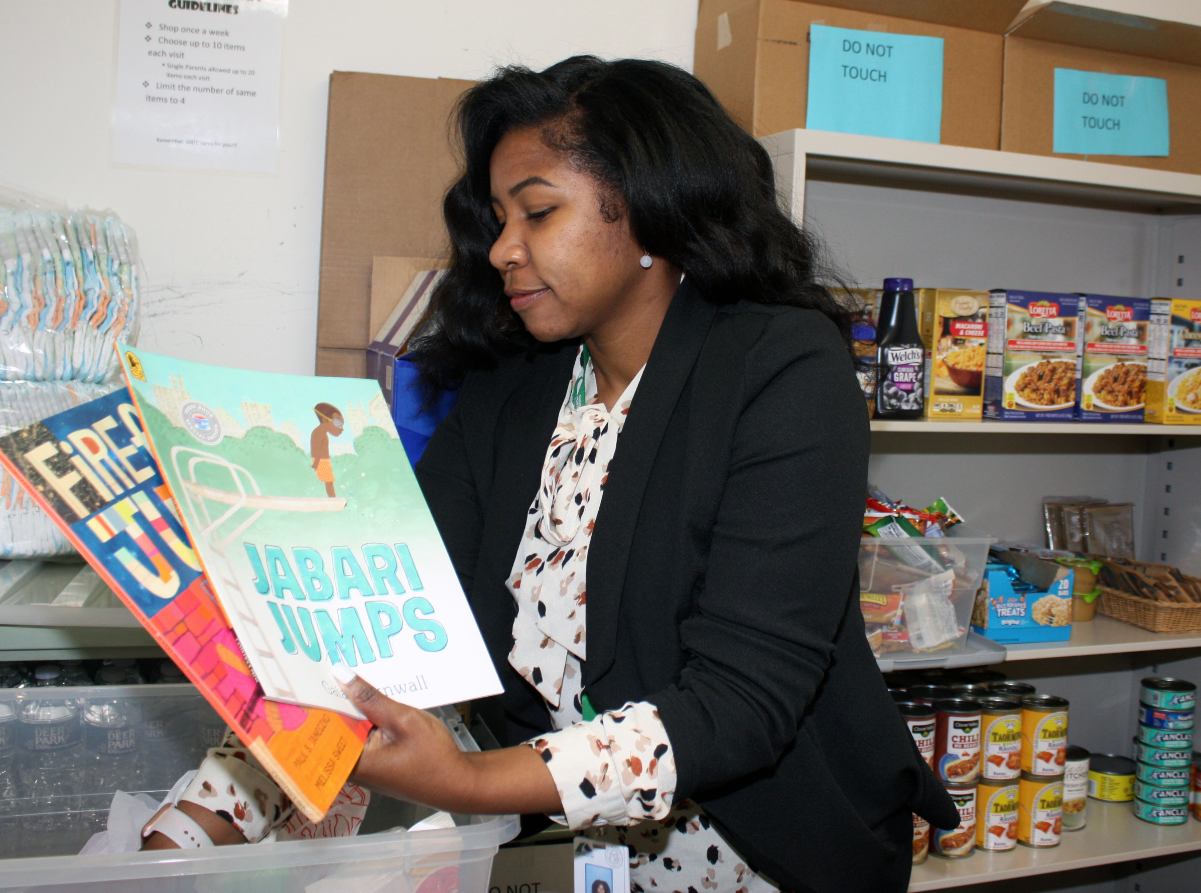 Daizha Staples, Special Populations coordinator at GNTC, inventories books and other items for children’s “tool kits” at the Floyd County Campus.
