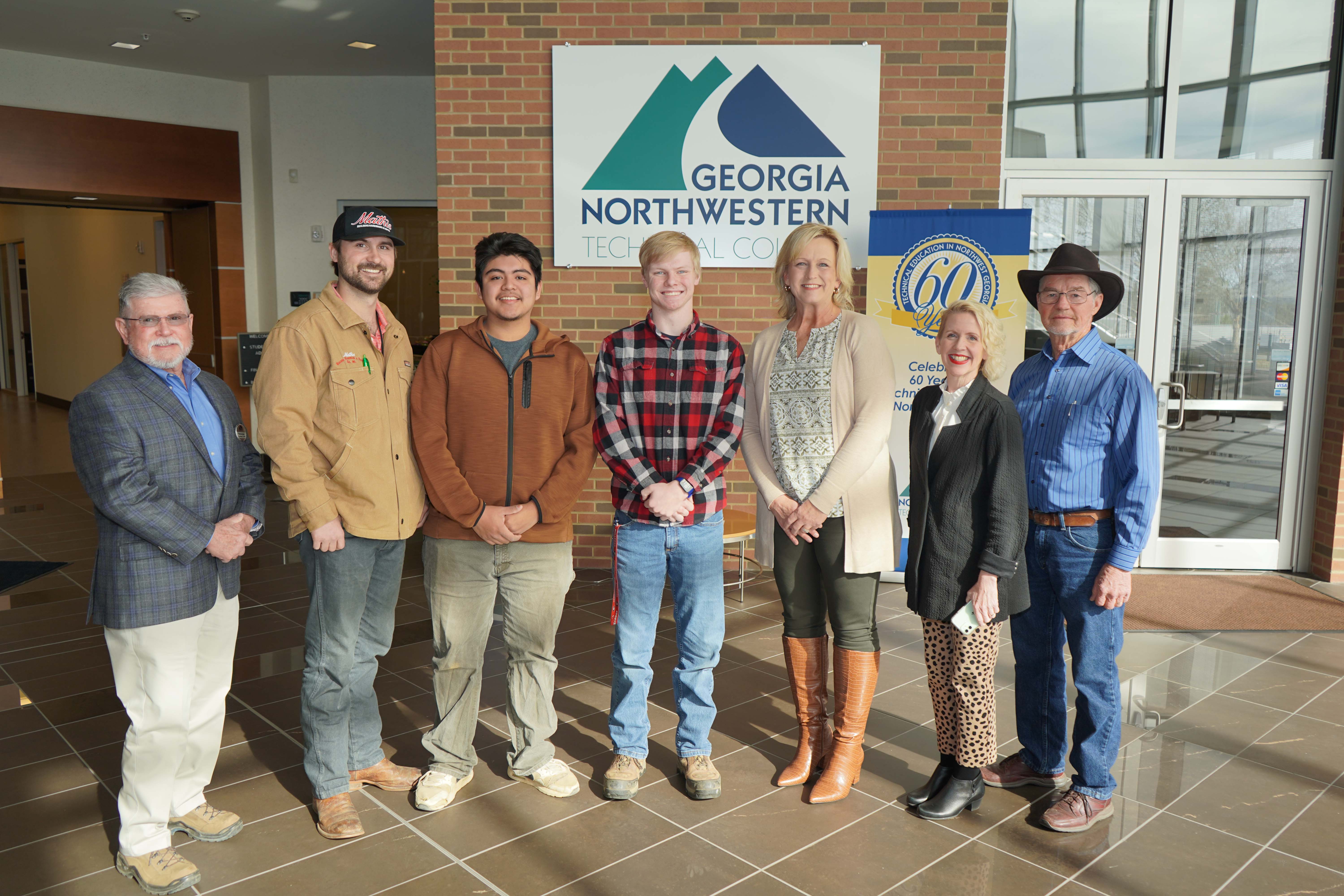 (From left) Phil Burkhalter, Phillip Burkhalter Builders LLC and GNTC Foundation trustee; Will Mathis, Mathis Builders Hardware and Supply and president of the RHBA; Franklin Ramirez, RHBA Scholarship recipient; Connor Rowell, RHBA Scholarship recipient; Connie Mathis, senior vice president and chief financial officer at River City Bank; Lauretta Hannon, executive director of Institutional Advancement and the GNTC Foundation; and Sammy Bartley, Sammy Bartley Properties.