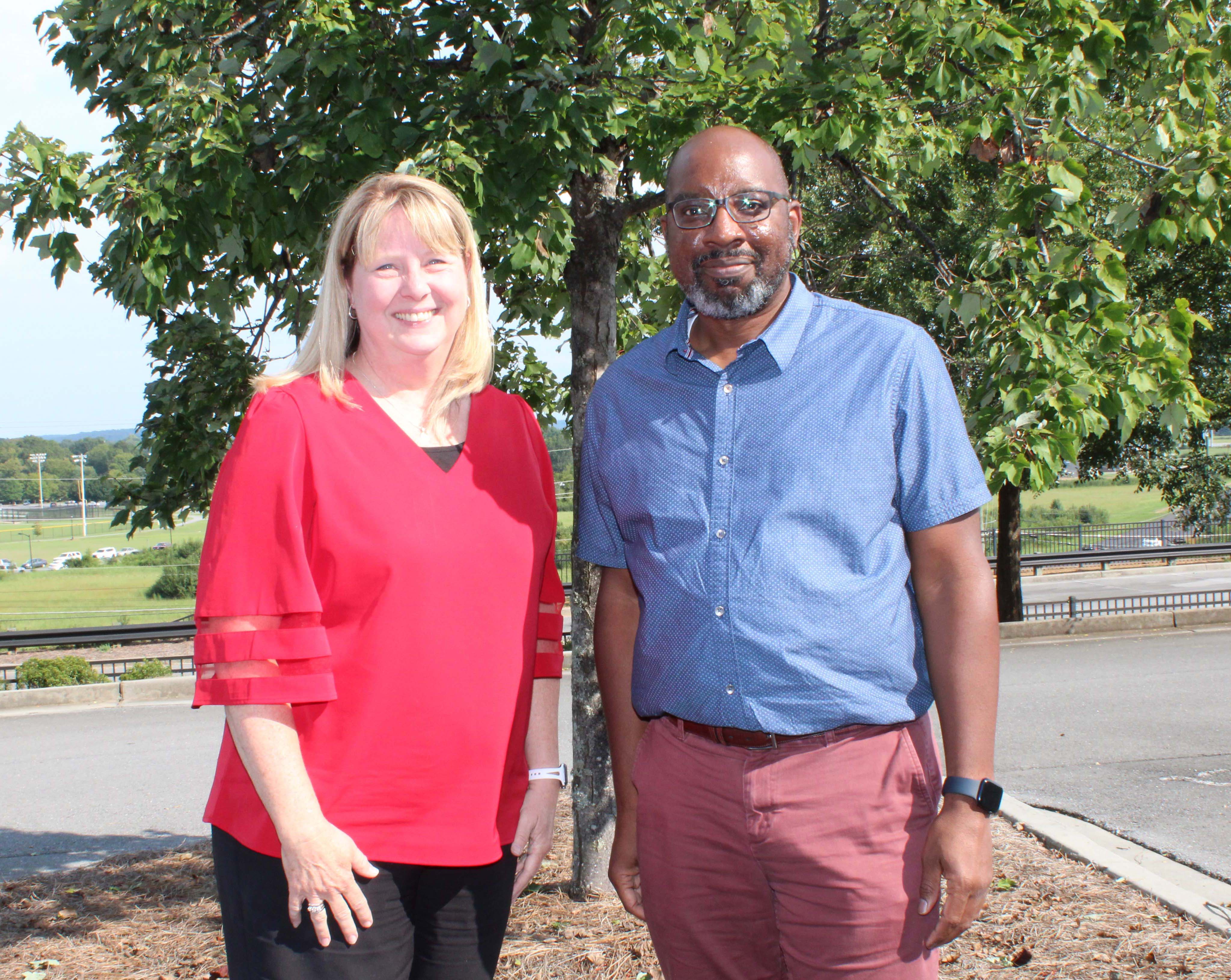 Dr. Heidi Popham (left), GNTC president, congratulates Torrance Ford, vice president of Talent Management at Shaw Industries Group Inc., after his appointment to GNTC’s Board of Directors.