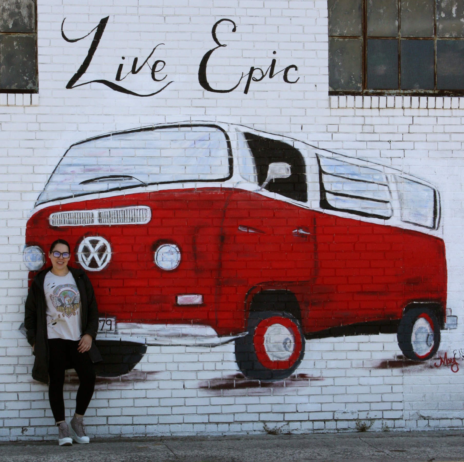 Viviana Ramirez poses outside Eclectic79 Boutique in downtown Dalton.