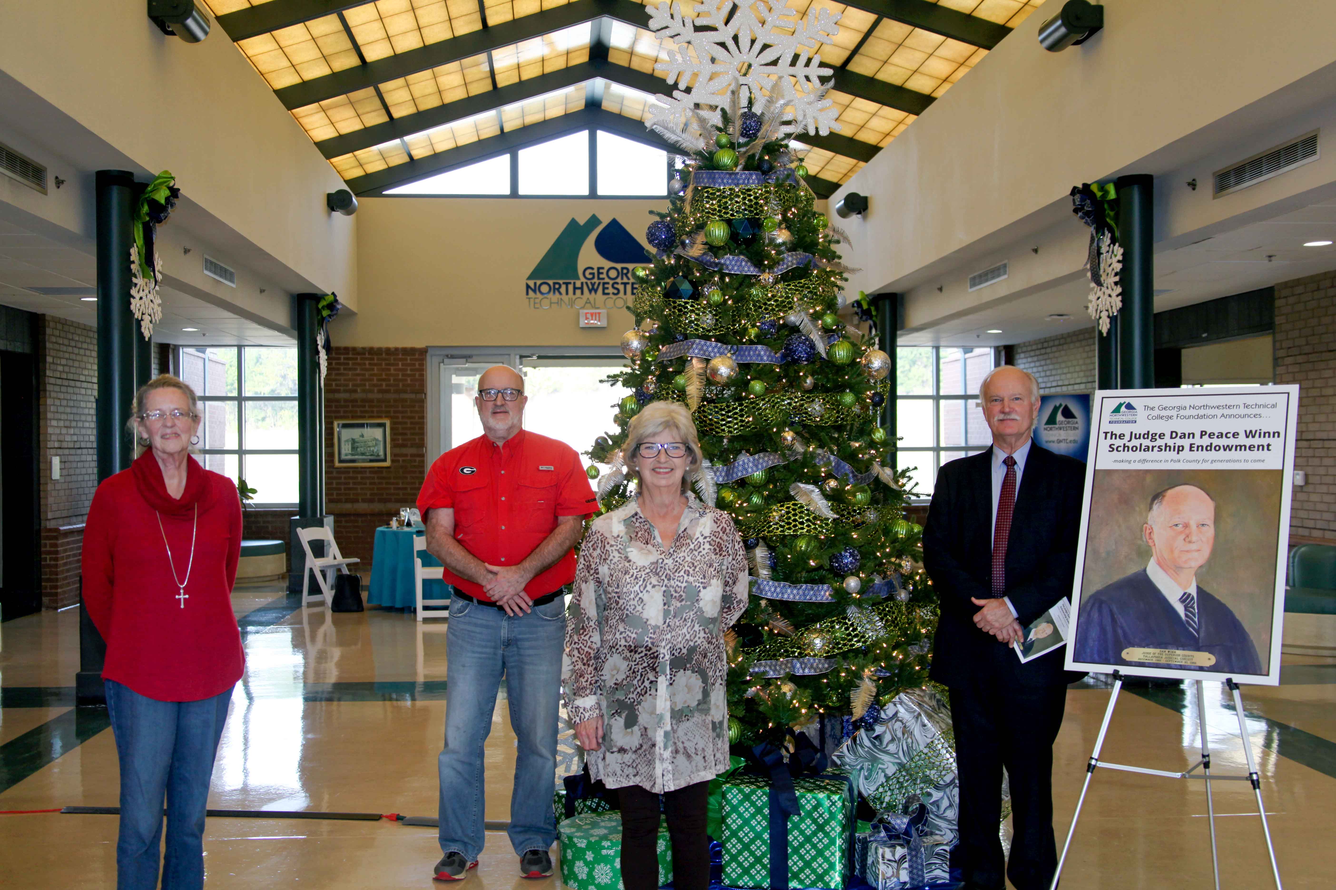 (From left to right) Nila Winn stands with her siblings Nick Winn, Darice Winn Lewis and Frank Winn during a luncheon on the Polk County Campus on Friday, Dec. 11. The siblings made a donation through the GNTC Foundation, which established a food pantry and an endowment scholarship in their father’s name. 