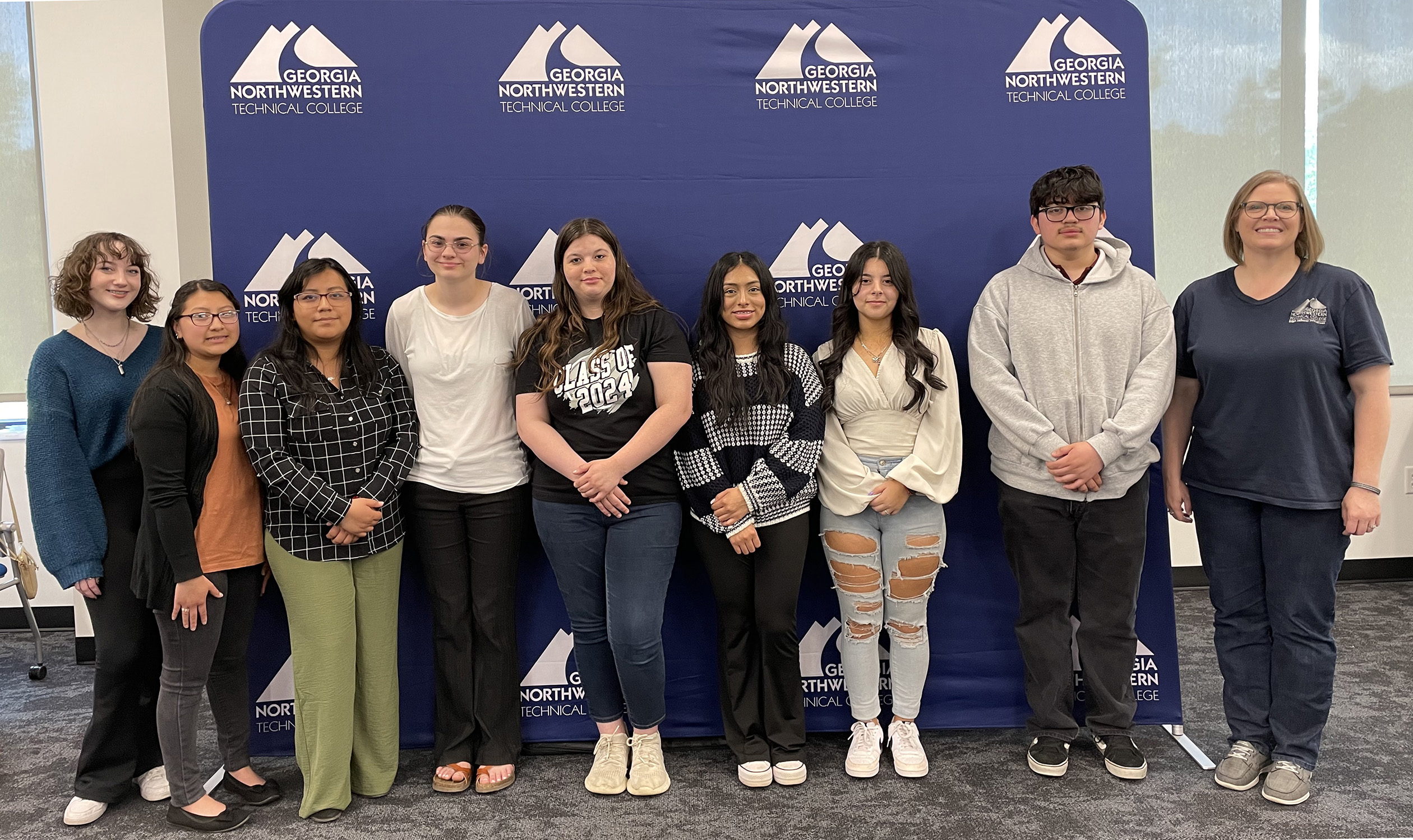 (From left) Dual Enrollment students Alana McGaughey, homeschool; Emely Vicente, North Murray High School; Bianka Ramirez, North Murray High School; Juilina Teasley, Coahulla Creek High School; Chelsea Ford, Southeast Whitfield High School; Estefani Morales, North Murray High School; Adamaris Jones, North Murray High School; Kerin Barrera, North Murray High School; and GNTC Career Transition Specialist Cora Pyles attend the Dual Enrollment reception at the Whitfield Murray Campus.
