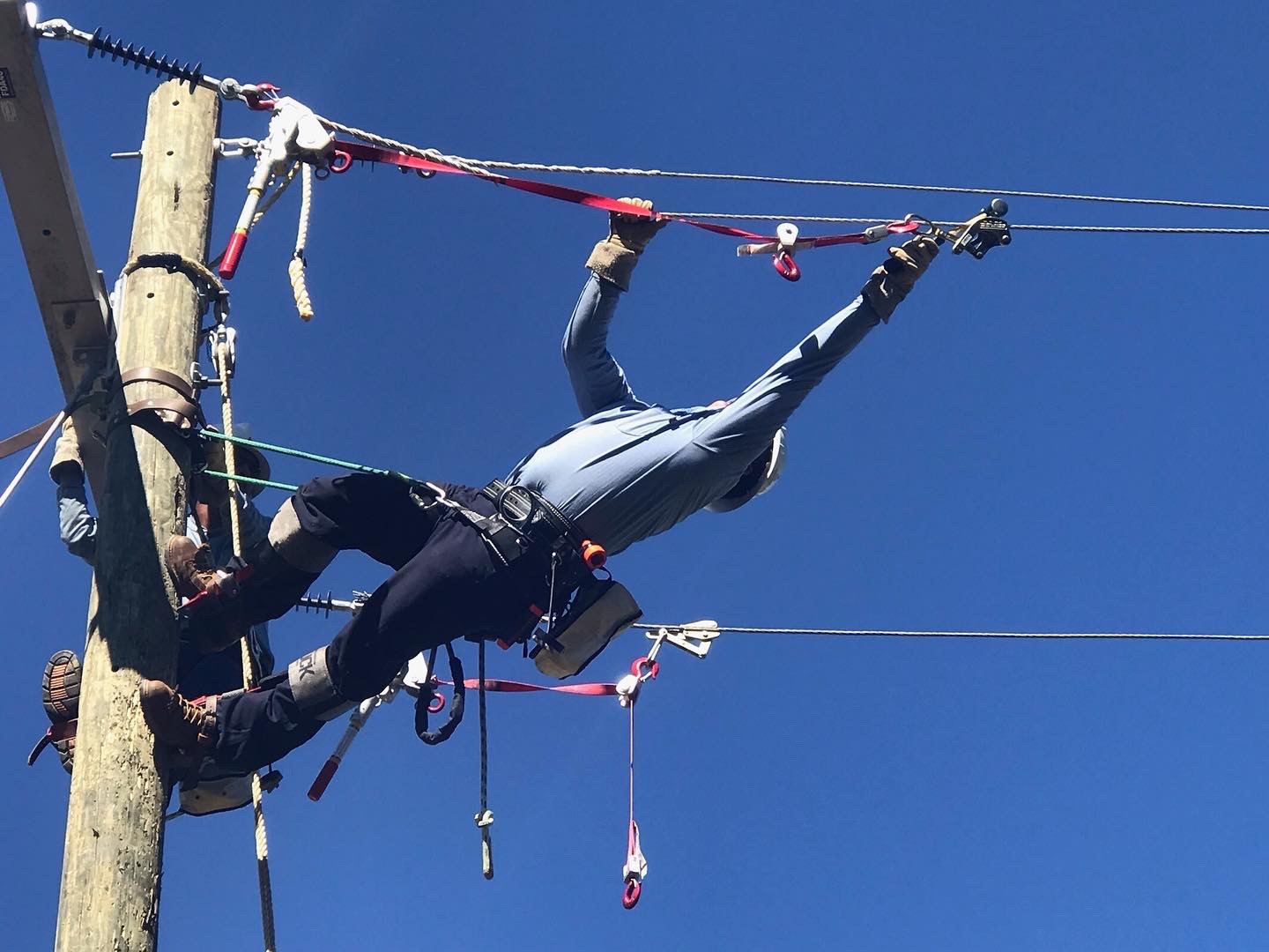 Salvador Barragan practices pulling wire as a student in GNTC’s Electrical Lineworker Program.