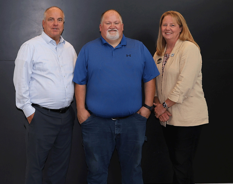 Recipient of the Governor Nathan Deal Scholarship stands with Dr. Heidi Popham and Russ DeLozier