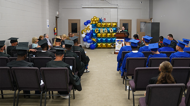 Floyd County Prison offenders celebrate their graduation May 29 at the Floyd County Prison.