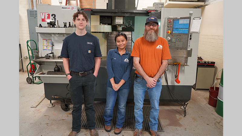 Bart Jenkins, program director and instructor of Precision Machining and Manufacturing at GNTC (right) poses with Gene Haas Scholarship recipients Jesse Nicholson (left) and Mayahuel Yaoapoqa