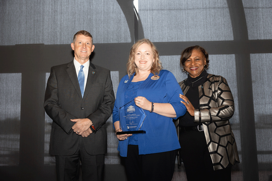 (From left) TCSG Commissioner Greg Dozier, GNTC Associate Vice President of Academic Affairs Jennifer Loudermilk and TCSG President of Executive Leadership and Talent Initiatives Dr. Alvetta Thomas celebrate Loudermilk's graduation as part of the 2025 Senior Leadership Academy class.