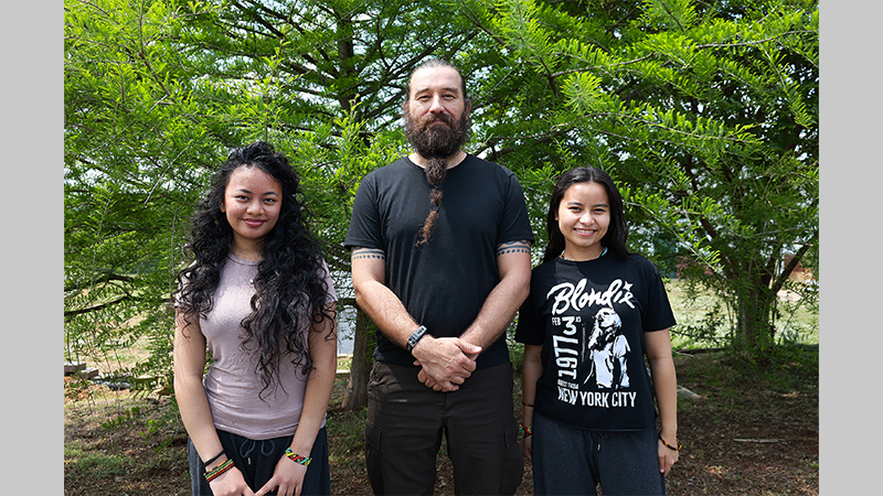 Olin Yaoapoqa (center) is proud of daughters Sueann (left), and Mayahuel (right).