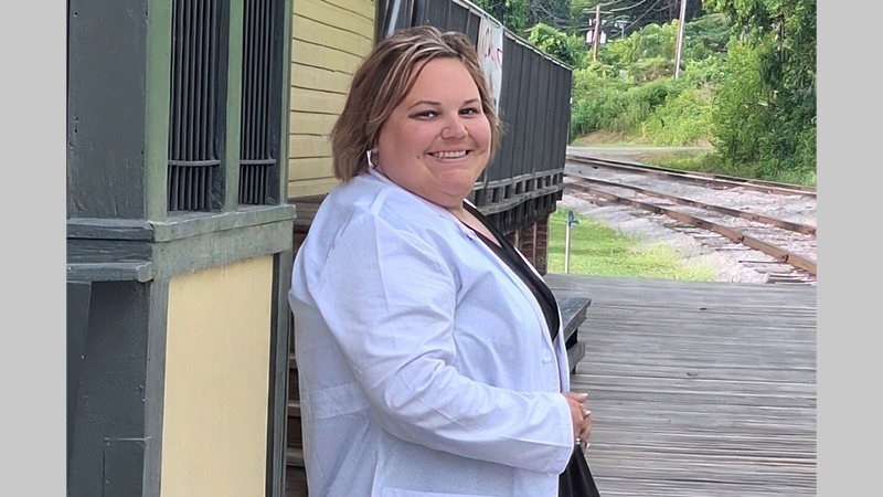 Jessica Motes celebrates her pinning ceremony