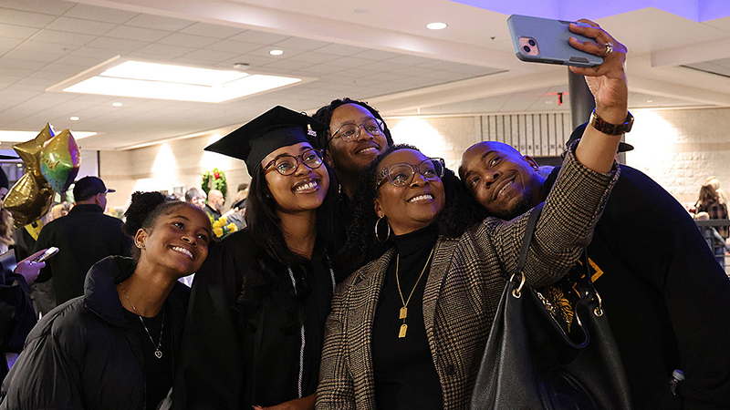 (From left) Baili Coast, Laiya Coast, G.W. Owens, Angela Owens and Byron Coast pose for a selfie. Laiya Coast earned an associate degree in Health Care Management.