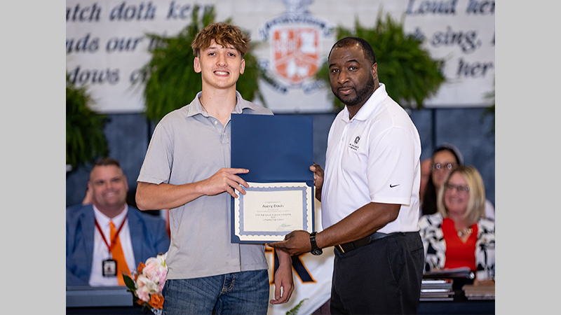Luther Ingram (right) presents LaFayette High School student Avery Davis with a GNTC Foundation High School Graduate Scholarship